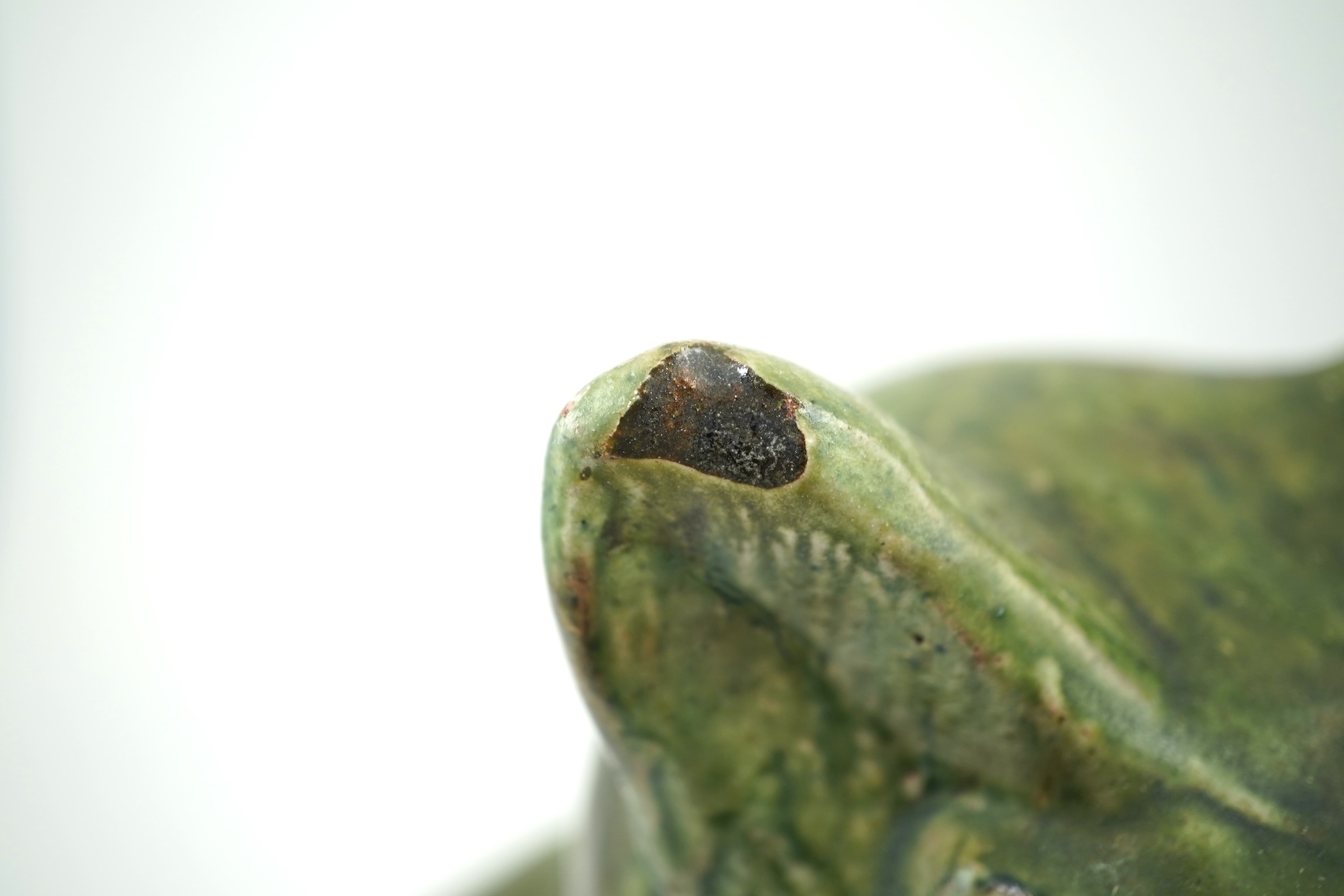 Ewenny Pottery: A large green-glazed figure of a seated cat